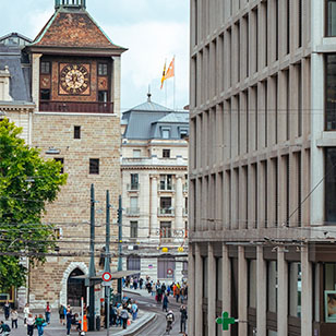 Historic clock tower and streets in central Geneva